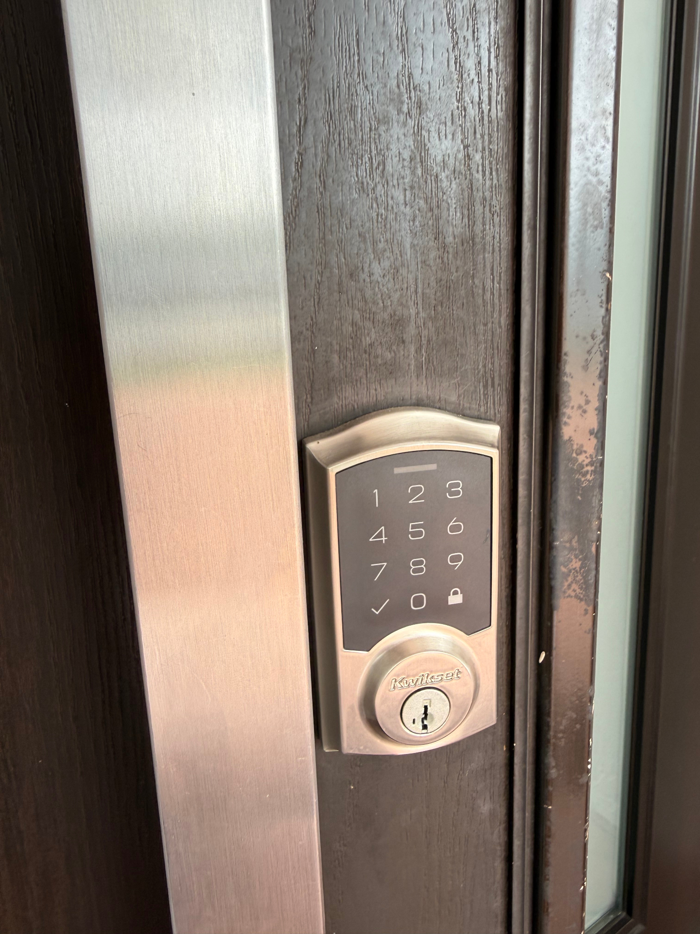 Smart door lock installation — keypad deadbolt exterior